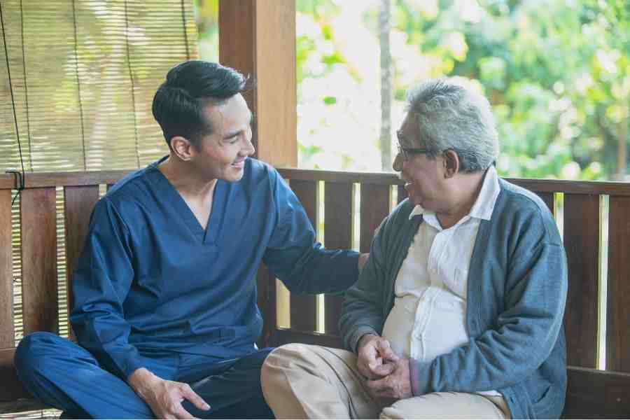 senior veteran receiving compassionate care at home from a family member